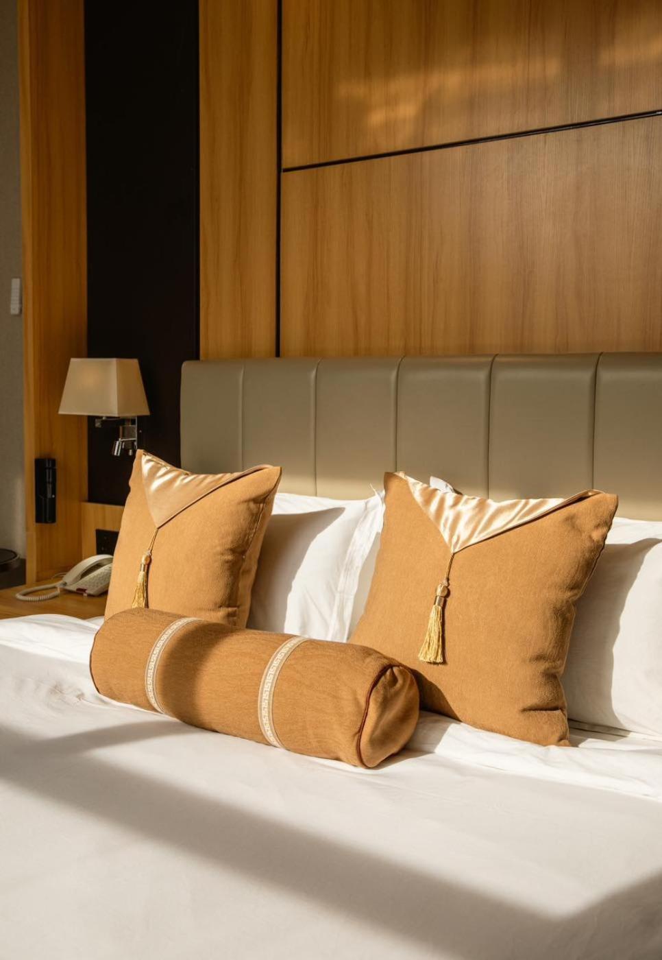 Hotel Diamond Prishtina Pristina Exterior photo Pillows on a bed
